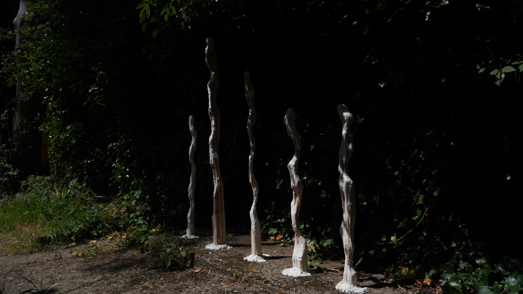 Wax sculptures illuminated in the garden