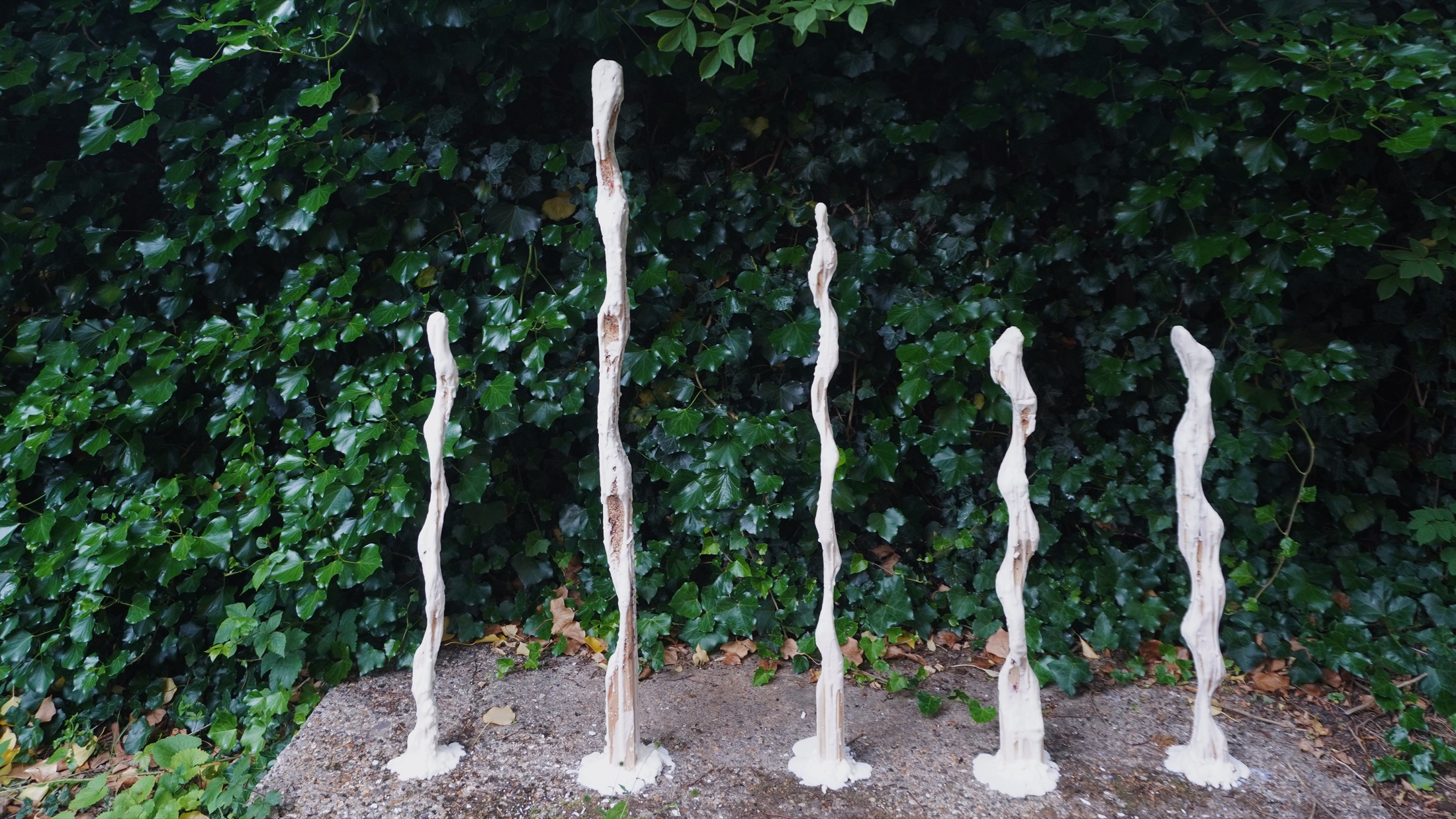 Wax sculptures installed in a garden