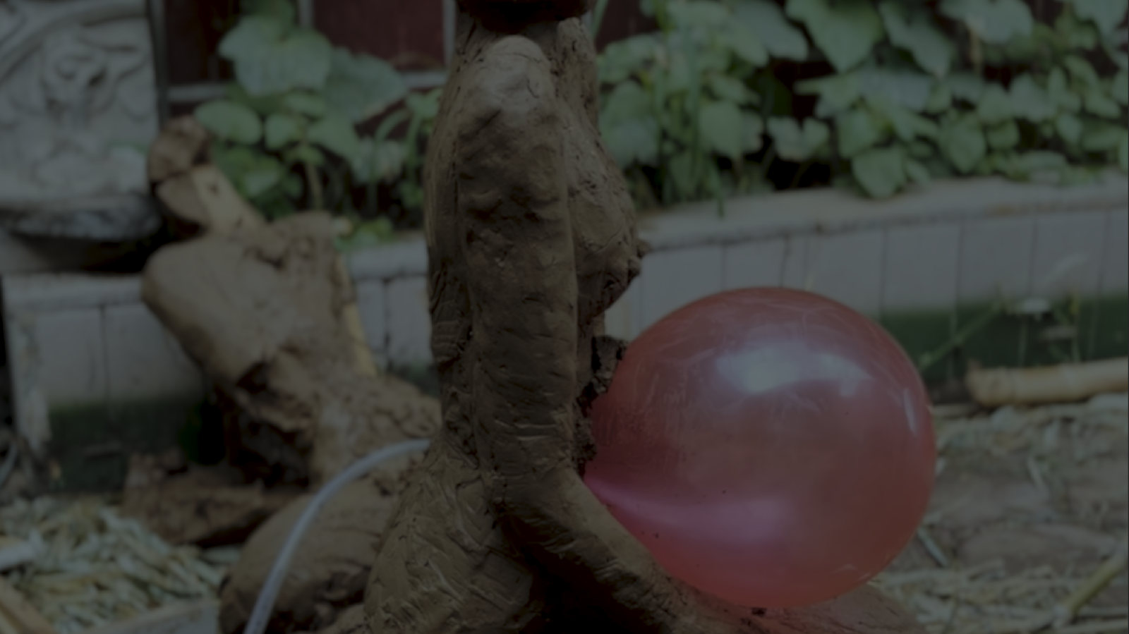 Woman and red balloon in a fragmented landscape
