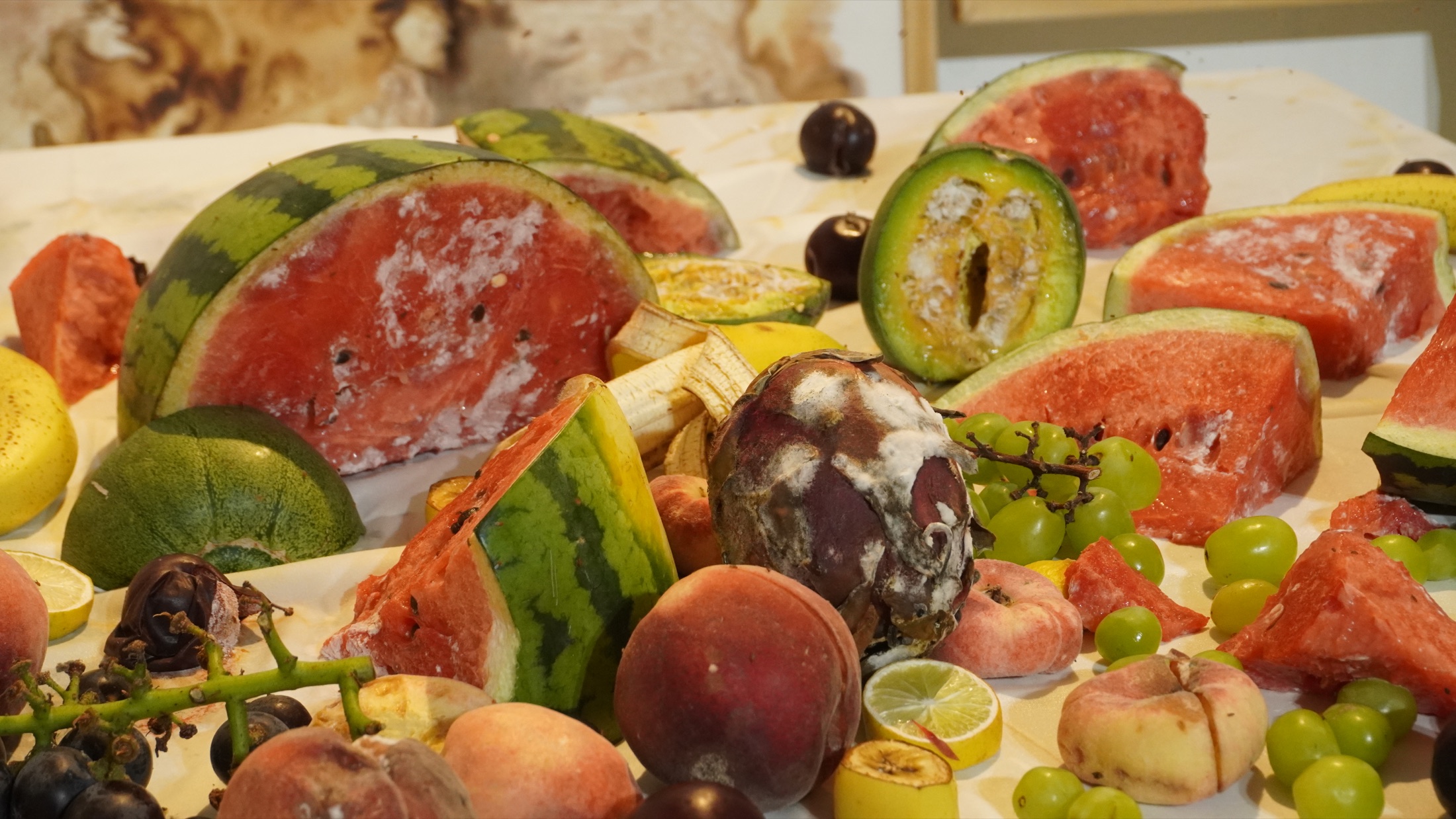 Close view of fruit and flowers used in the work
