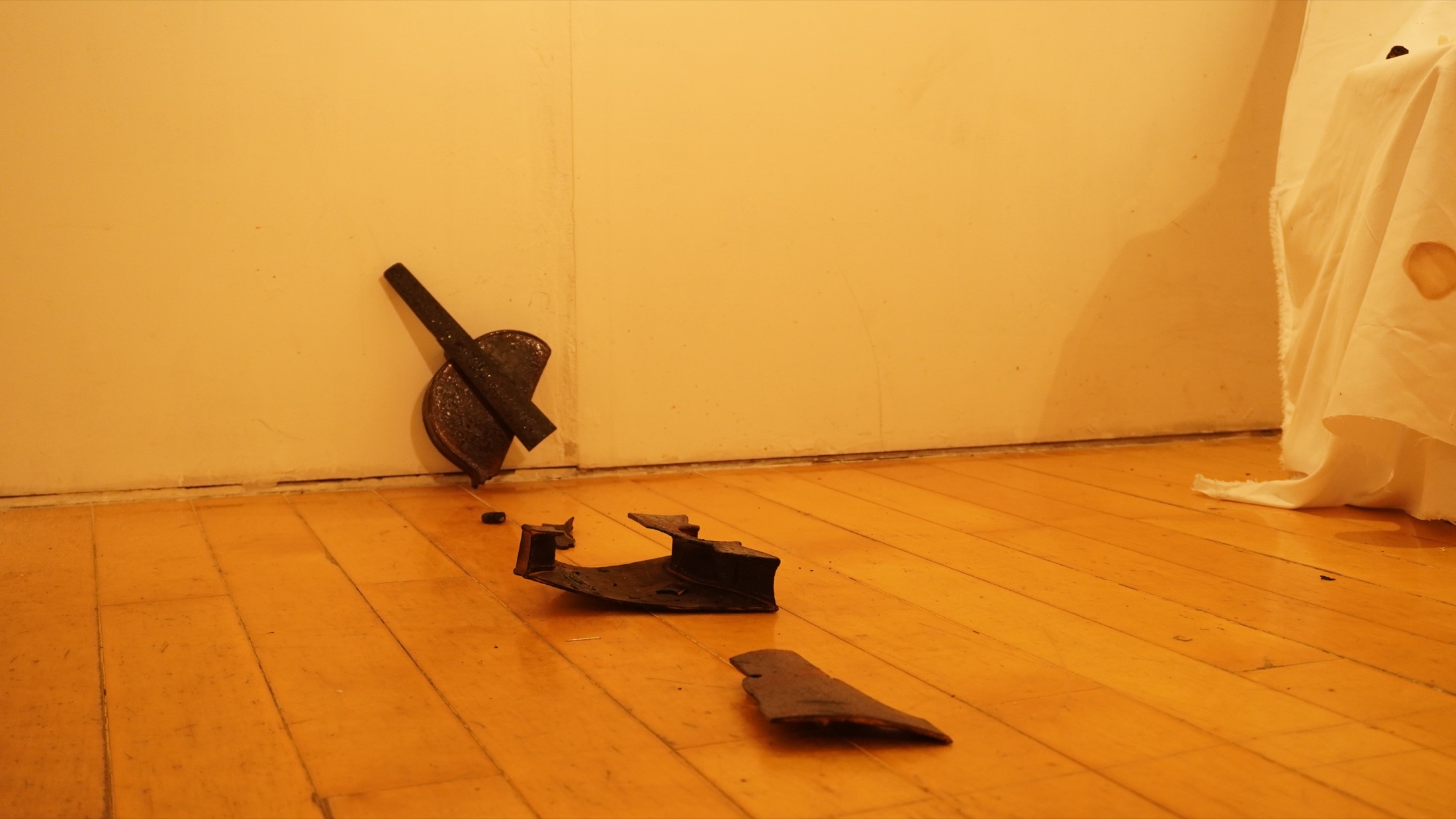 Ashes and sculptural objects on the floor