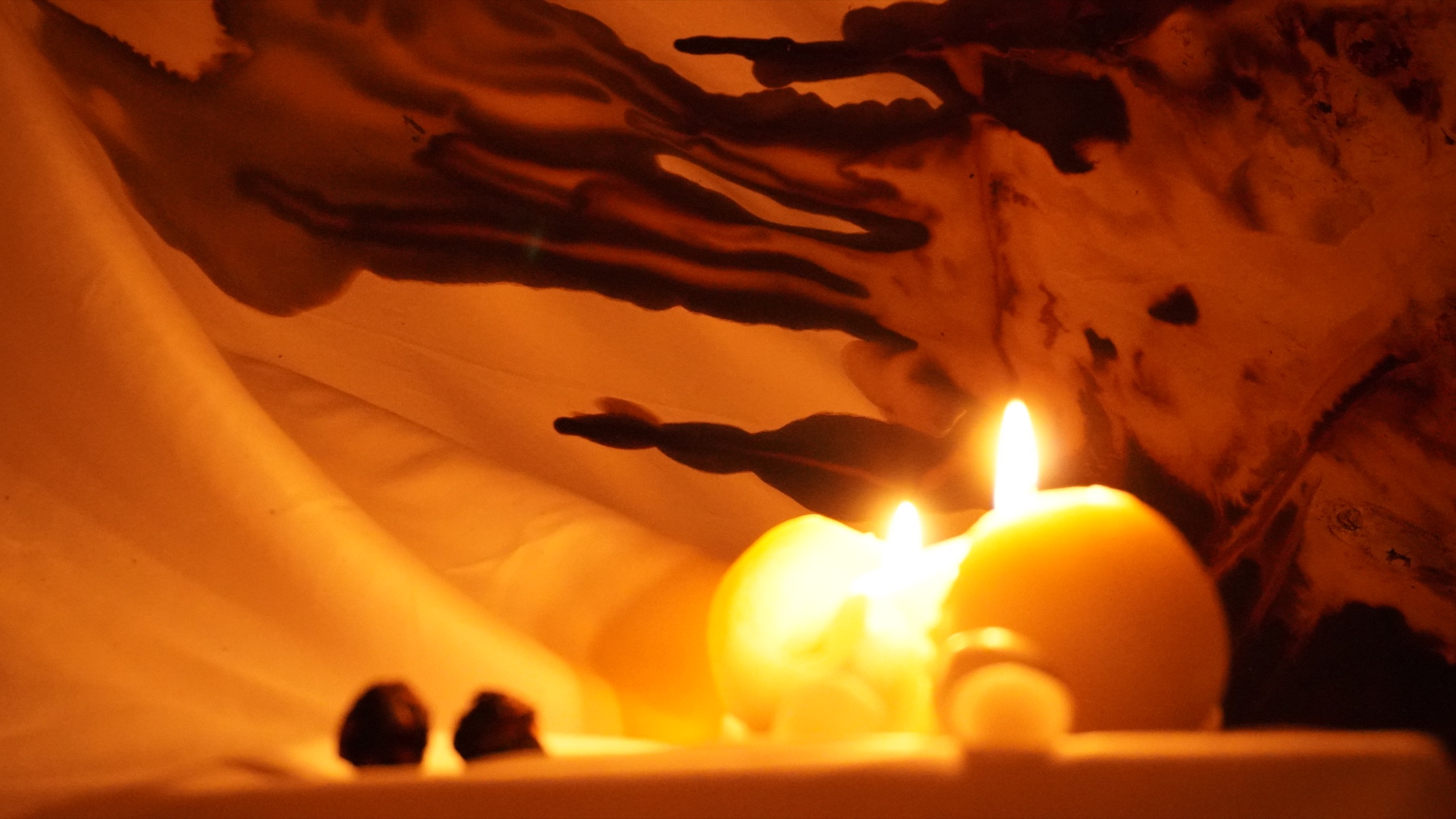 Warm candlelit installation detail